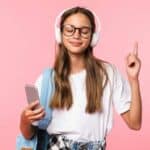 Teen listening to music in mobile