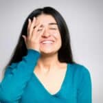 Woman wiping tears and feeling happy